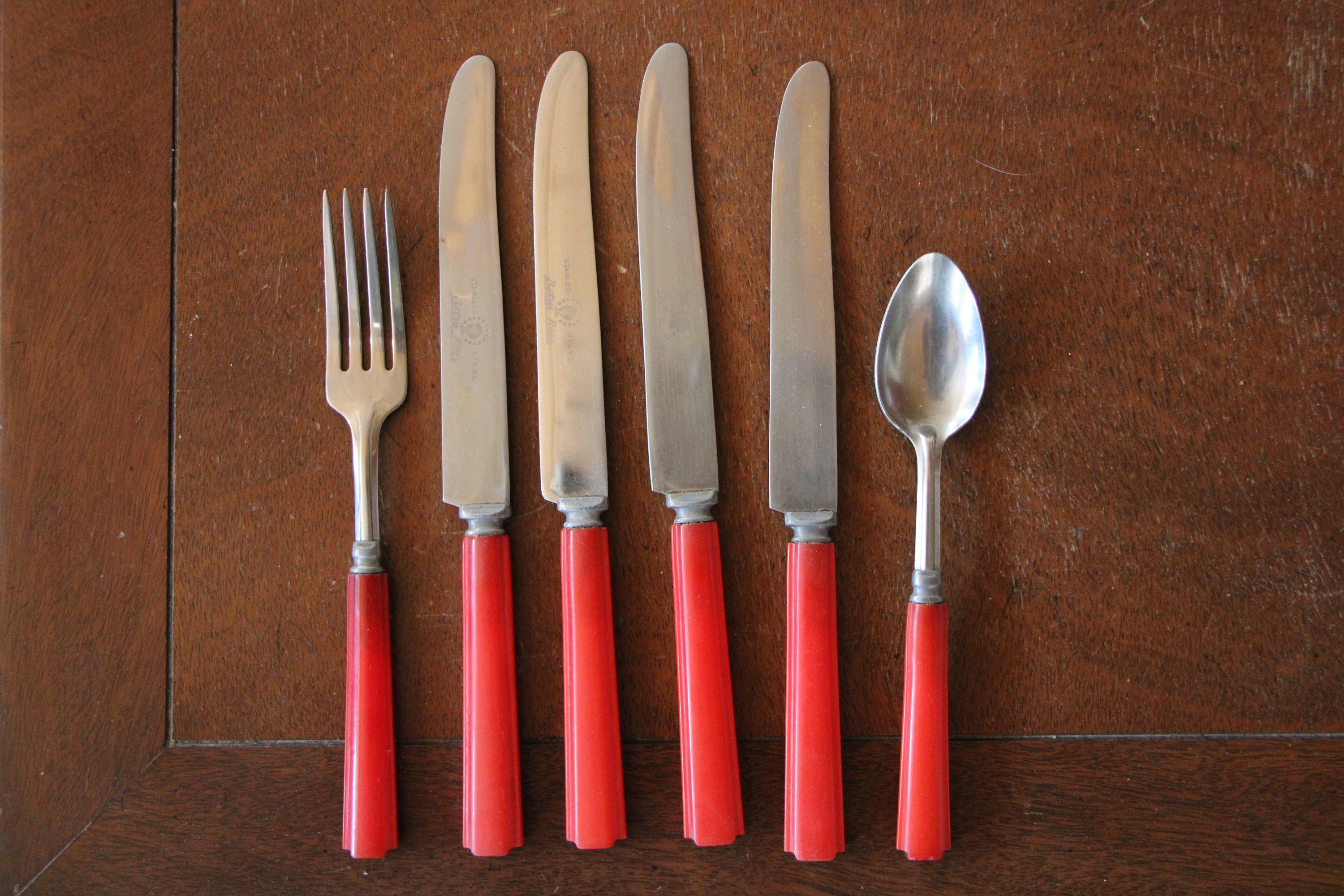 Vintage red shop handled silverware