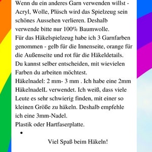 May include: A close-up of a text document with instructions for crocheting a toy. The text is in German and includes the words "Materialien", "Baumwolle", "H&auml;keln", and "H&auml;kelnadel".