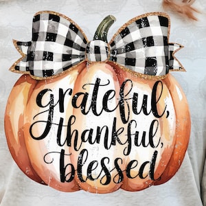 May include: A watercolor pumpkin with a black and white checkered bow and the text "grateful, thankful, blessed".