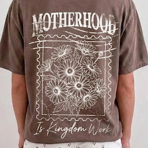 Vintage floral Motherhood Is Kingdom Work Christian mom PNG design with distressed postage stamp artwork