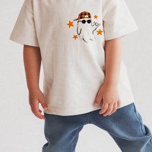 Kids Halloween ghost PNG with orange plaid baseball cap and sunglasses