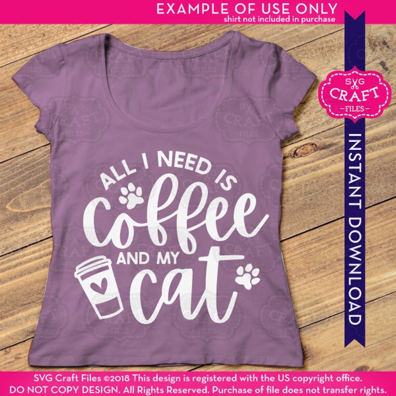 May include: Purple t-shirt with white text that reads "All I need is coffee and my cat" with a coffee cup and paw print graphic.