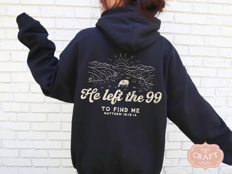 May include: Black hooded sweatshirt with a white graphic print of a landscape with a sheep and the text "He left the 99 to find me Matthew 18:12-14".