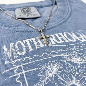 Christian motherhood graphic for boutique apparel featuring vintage floral line art and retro texture