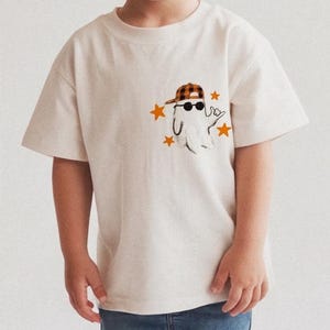 Boys ghost shirt graphic with sunglasses, stars, and casual hand gesture