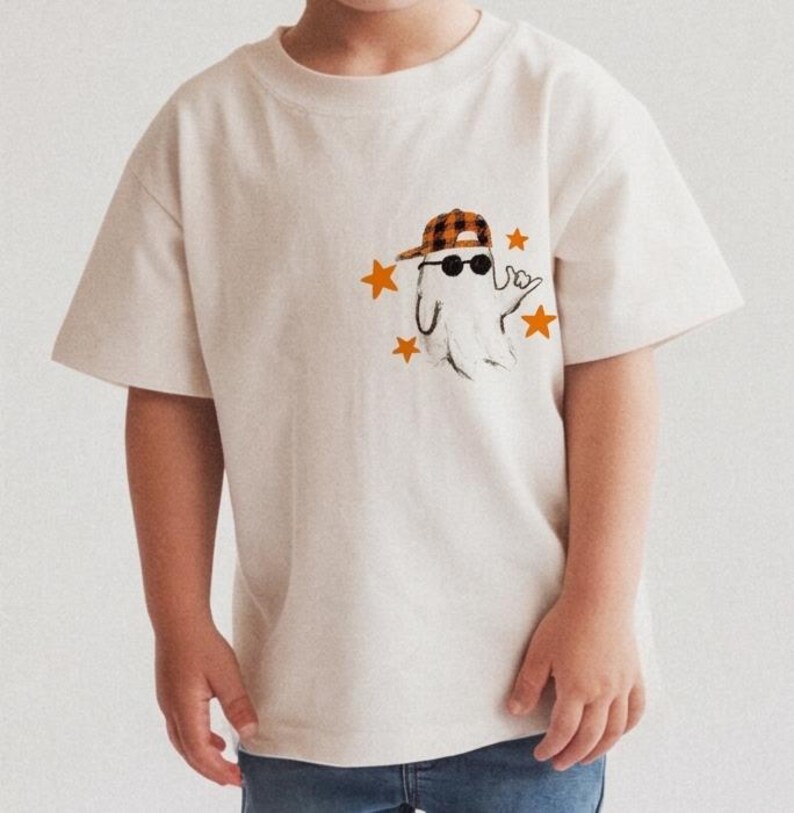 Boys ghost shirt graphic with sunglasses, stars, and casual hand gesture