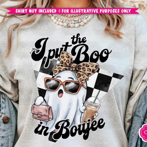 May include: A white ghost wearing sunglasses and a leopard print bow, holding a pink purse and a cup of coffee. The text "I put the Boo in Boujee" is written in black letters on a white background.