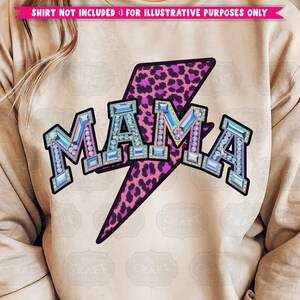 May include: A beige sweatshirt with a pink and black leopard print lightning bolt and the word "MAMA" in iridescent rhinestones.