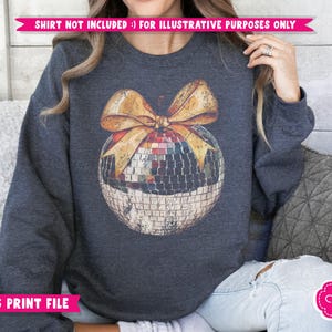 May include: A dark blue sweatshirt with a gold bow and a disco ball ornament design. The design is a vintage-style illustration of a disco ball with a gold bow on top. The sweatshirt is a great option for a holiday party or a fun, festive look.