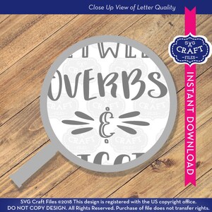 May include: Close-up view of a gray and white design with the text "I Will Over Verbs & Nouns". The design is surrounded by a gray circle and a magnifying glass.