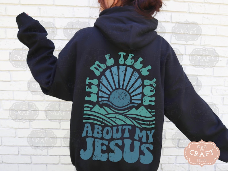 May include: Black hoodie with a graphic print of a sun setting over a mountain range. The text "Let me tell you about my Jesus" is printed in a retro font.