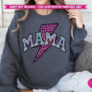 May include: A dark gray sweatshirt with a pink and black leopard print lightning bolt and the word "MAMA" in rhinestones.