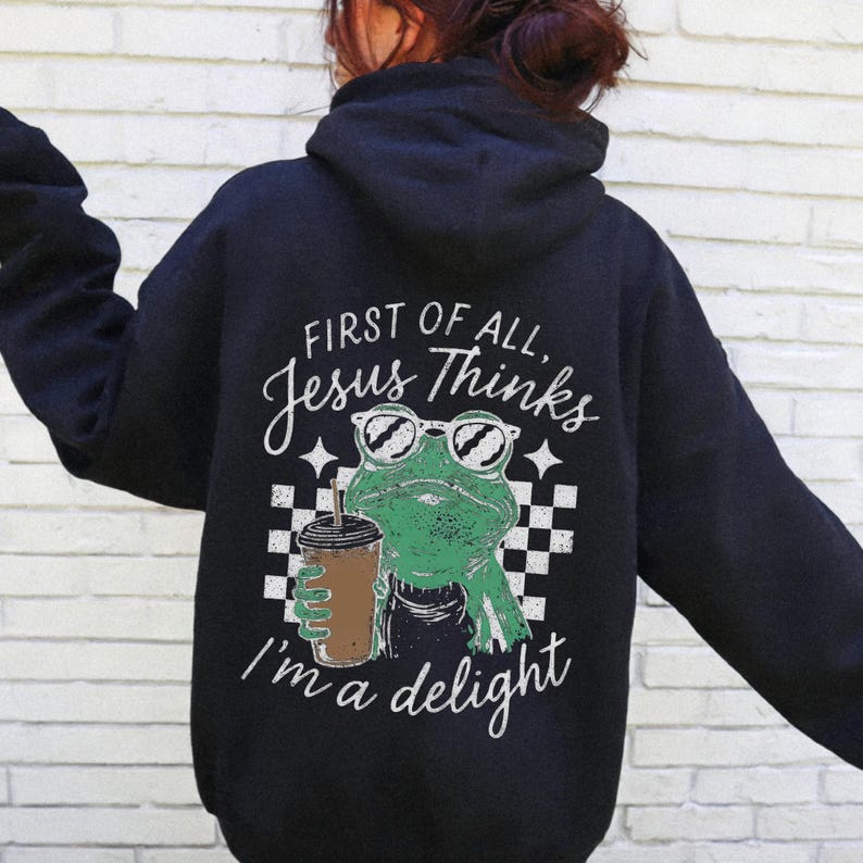 Trendy Jesus shirt design with frog character, sunglasses, and Christian quote artwork.