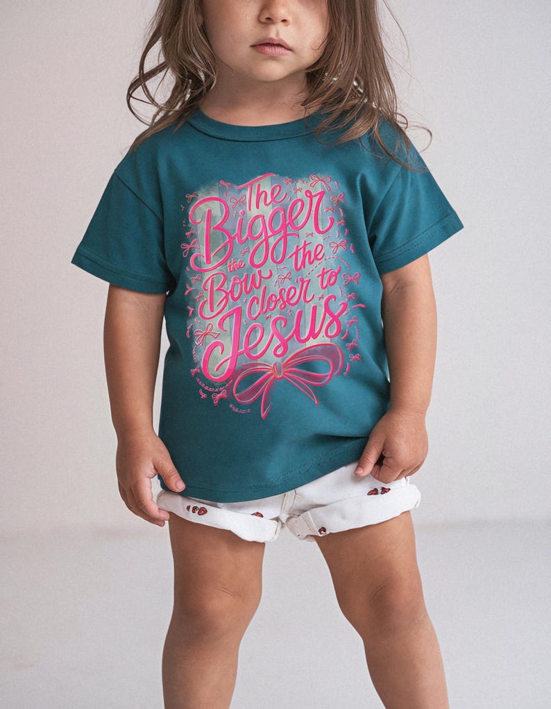 Faith-inspired girls t-shirt design with bow graphic