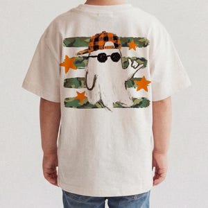 Camo Halloween PNG with hand-drawn ghost wearing a plaid cap