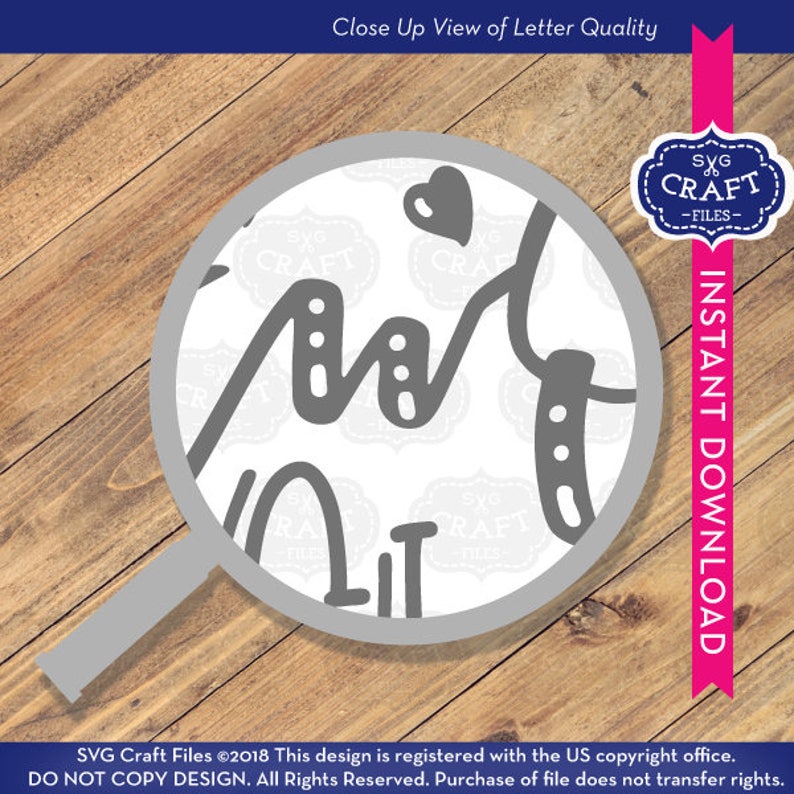 May include: Close-up view of a magnifying glass showing the quality of a digital design file for a craft project. The design is a handwritten word "Art" with a heart and a small design element. The text "SVG Craft Files" is repeated in the background.