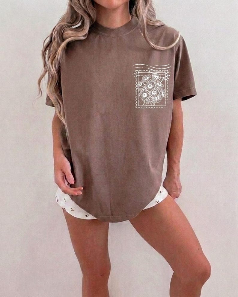 Retro motherhood faith shirt graphic featuring hand drawn flowers and Christian typography for women