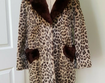 Stunning original 1960s faux fur leopard print coat by AUBREY'S furriers prop