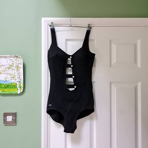 Amazing 1970s vintage black backless swimsuit/bathing costume with cutouts and pearl button detail