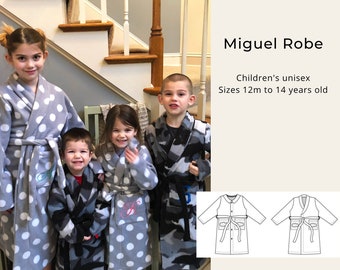 May include: Four children wearing grey and camouflage robes with white polka dots. The robes have a tie belt and pockets. The text "Miguel Robe" and "Children's unisex Sizes 12m to 14 years old" is visible in the image. Two line drawings of the robe are also shown.