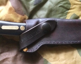 The”NEW STYLE”  Schrade 150T knife sheath.  Knife Is Not Included! I will not refund because you thought you were getting a knife too.