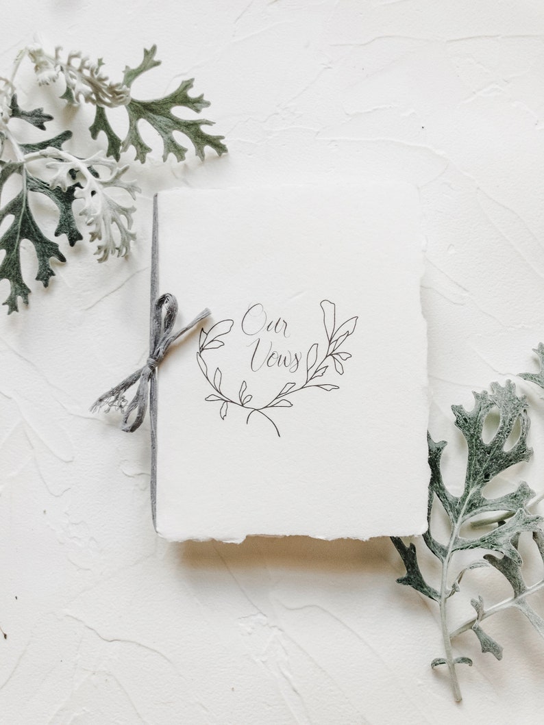 Smaller Wedding Vow Book on Handmade Paper with Cotton Ribbon Flat Lay Styling OUR Vine Wreath