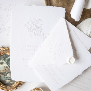 May include: A white wedding invitation with a floral design and the text "JAMES ROP & SOPHIE to JANUA in Darze, Ma. ACCEPT MUST DECLINE RESPOND".
