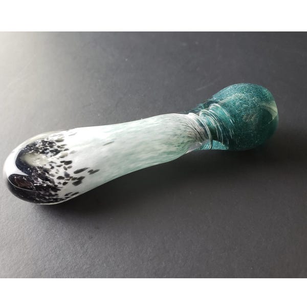 Glass chillum pipe with black, white, and sparkly blue