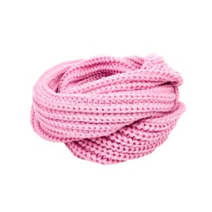 May include: A pink knitted infinity scarf. The scarf is made of a soft, chunky yarn and is perfect for keeping warm in the winter.