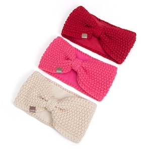 May include: Three knit headbands in red, bright pink, and cream, each featuring a central bow detail and a small brown tag with the text ppk. The headbands have a textured, chunky knit exterior and a solid-colored fabric lining on the interior.