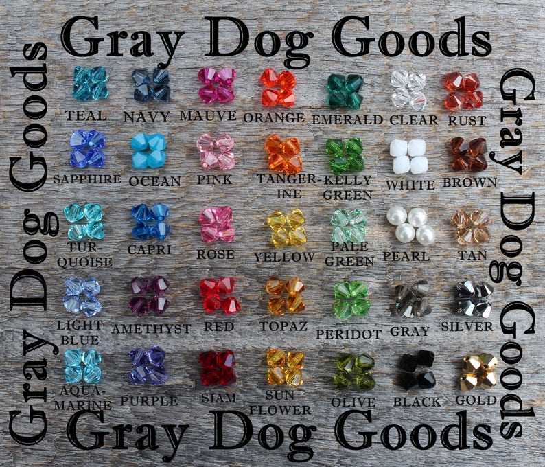 K&ouml;nnte beinhalten: Eine Tabelle mit 24 verschiedenen farbigen Kristallperlen, die mit ihren Farbnamen beschriftet sind. Die Tabelle tr&auml;gt den Titel "Gray Dog Goods".