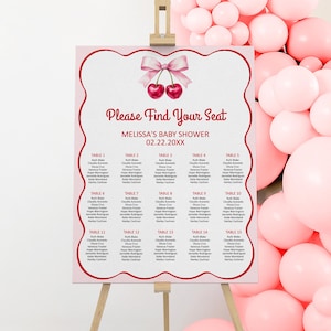 May include: A pink and red seating chart with a cherry design for a baby shower. The chart lists tables and names for guests. The text reads "Please Find Your Seat", "Melissa's Baby Shower", and "02.22.20XX".
