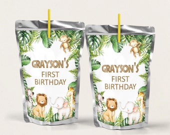 May include: Two silver juice pouches with labels featuring a jungle theme. The labels have a green leafy border with a white background. The text on the labels reads "Grayson's First Birthday". The labels also feature illustrations of a lion, elephant, giraffe, zebra, and monkey.