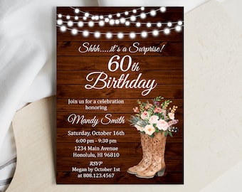 May include: A rustic wood background with white string lights, a floral arrangement, and a pair of brown cowboy boots. The text "Shhh....it's a Surprise! 60th Birthday" is at the top of the invitation. The invitation also includes the text "Join us for a celebration honoring Mandy Smith Saturday, October 16th 6:00 pm - 9:30 pm 1234 Main Avenue Honolulu, HI 96810 RSVP Megan by October 1st at 808.123.4567".