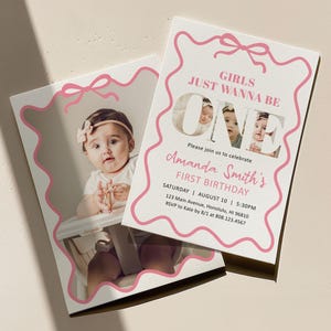 May include: Two rectangular birthday invitation cards featuring a pink wavy border and a pink bow graphic. The text reads Girls Just Wanna Be One, Amanda Smith's First Birthday, with event details including date, time, location, and RSVP contact information.
