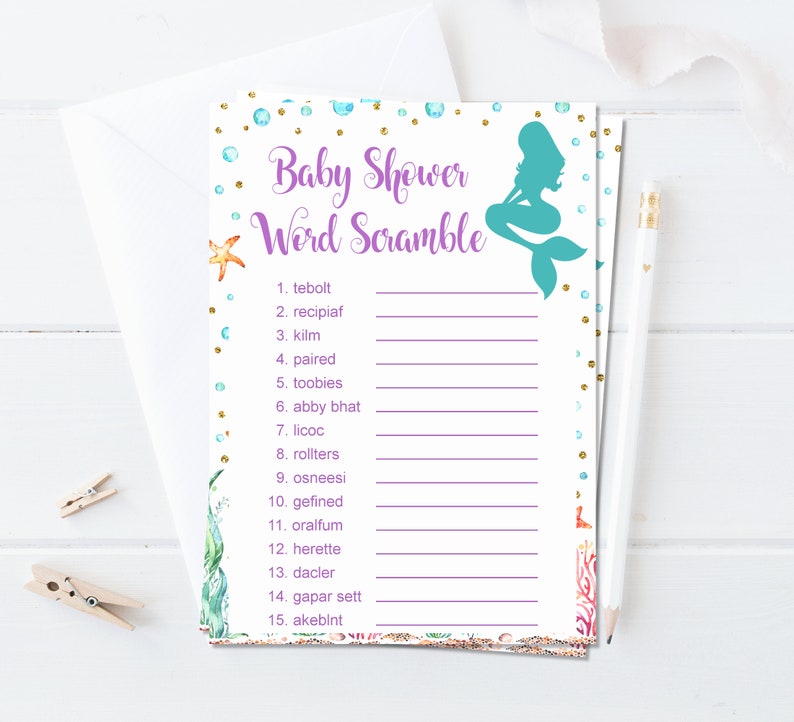 May include: A printable baby shower game with a mermaid illustration and a list of 15 words to unscramble. The words are related to the ocean and babies. The game is printed on white paper with a purple border and gold glitter accents.