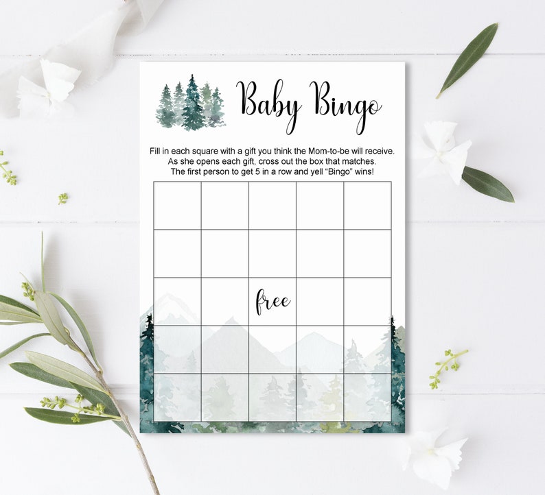 May include: A printable baby bingo card with a watercolor background of a forest scene. The card has a 5x5 grid with squares for players to fill in with gifts they think the mom-to-be will receive. The card also has the text "Baby Bingo" and "free" in the center square.