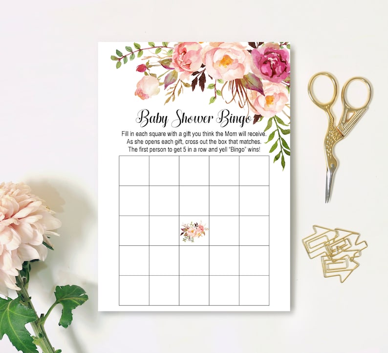 Op de afbeelding: Een printbare baby shower bingo kaart met een bloemenontwerp. De kaart bevat instructies om elk vierkant in te vullen met een cadeau waarvan je denkt dat de moeder het zal ontvangen. Terwijl ze elk cadeau opent, streep je het overeenkomende vakje door. De eerste persoon die 5 in een rij krijgt en "Bingo" roept, wint!