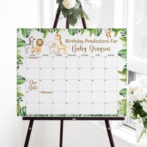 May include: A white calendar on an easel with the text "Birthday Predictions For Baby Grayson." The calendar features jungle animal illustrations and a leafy border. The due date is February 1st.