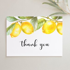 May include: A white card with a lemon branch illustration and the text "thank you".