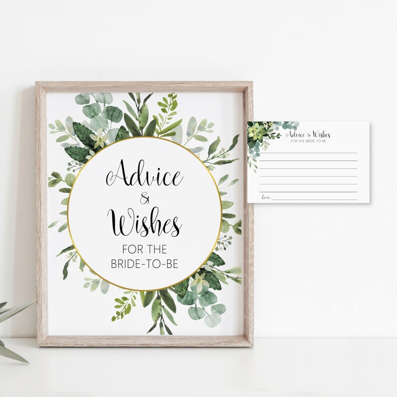 May include: A printable sign with a gold circle and green foliage around it. The text on the sign reads "Advice & Wishes for the Bride-to-Be". A smaller card with the text "Advice & Wishes for the Bride-to-Be" is also included.