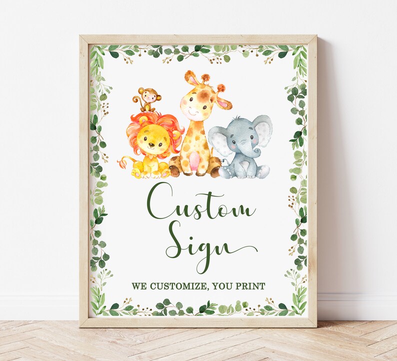 May include: A printable sign with a green leafy border featuring a lion, giraffe, monkey, and elephant. The sign says "Custom Sign" and "We customize, you print".