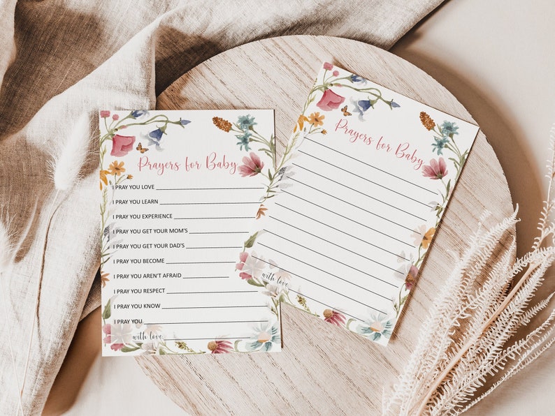 May include: Two printable cards with a floral border and the text "Prayers for Baby". The cards have a list of prayers for a baby, such as "I pray you love", "I pray you learn", and "I pray you experience".