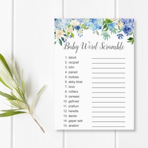 May include: A white baby shower game card with a floral border of blue and cream flowers. The text "Baby Word Scramble" is written in elegant script. The card includes numbered lines for answers.