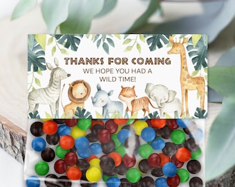 May include: A small clear plastic bag filled with colorful candy. A white card with a jungle animal theme is attached to the bag. The card says "Thanks for coming. We hope you had a wild time!"