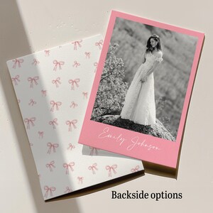 May include: A pink and white wedding invitation with a photo of a bride in a white dress. The invitation has the text "Emily Johnson" and a bow pattern on the back. The words "Backside options" are also visible.