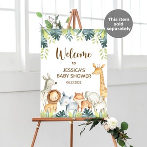 May include: Welcome to Jessica's Baby Shower sign with a jungle theme. The sign features a giraffe, zebra, lion, rhino, tiger, and elephant with green leaves and a white background. The date of the shower is 06.12.2021.