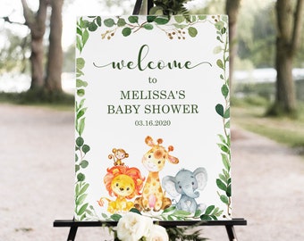 May include: Welcome to Melissa's Baby Shower sign with a green leafy border and a white background. The sign features a cartoon lion, giraffe, and elephant. The date 03.16.2020 is printed below the text.