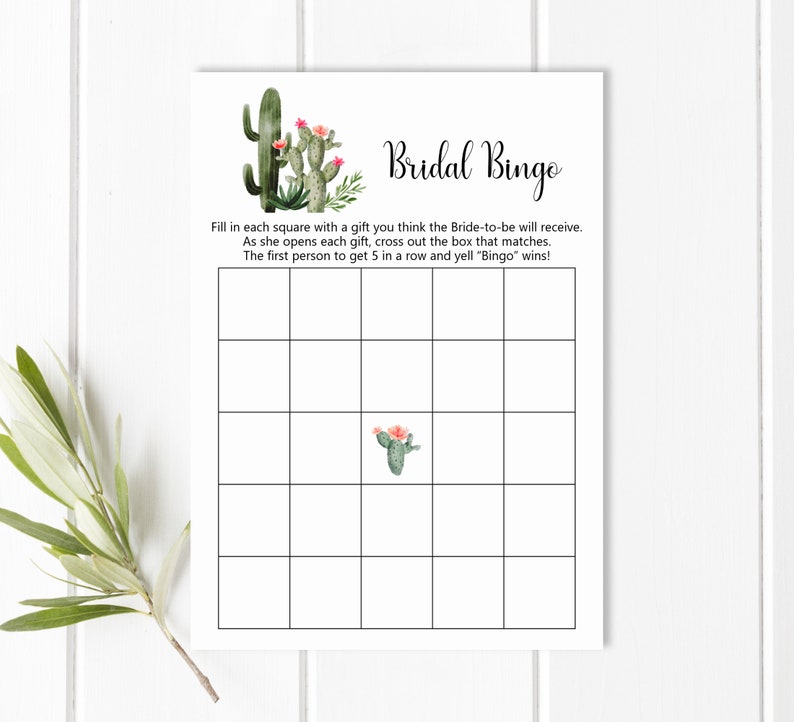 May include: A printable bridal shower bingo card with a cactus theme. The card has a 5x5 grid with squares to fill in with gifts the bride-to-be will receive. The text "Bridal Bingo" is at the top of the card.