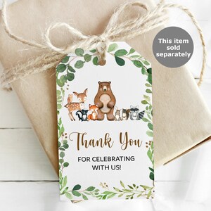 May include: Thank you for celebrating with us!  A white tag with a green leafy border features a brown bear and other woodland animals.  The tag is tied with twine.